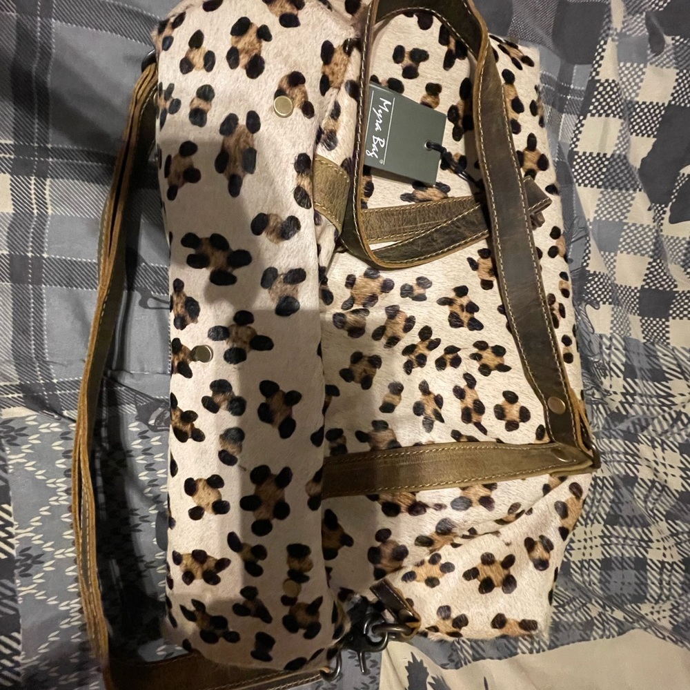 Myra mini duffel bag with tags